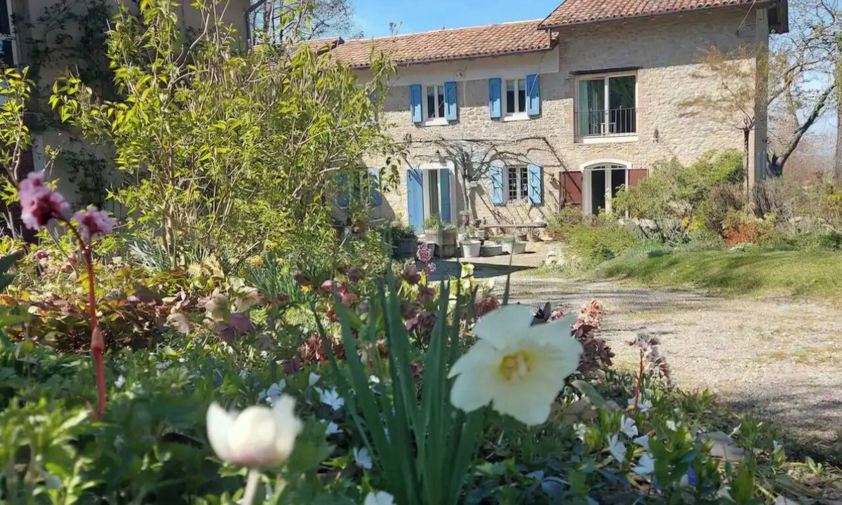 Samone House | A charming stone house set in a hillside garden