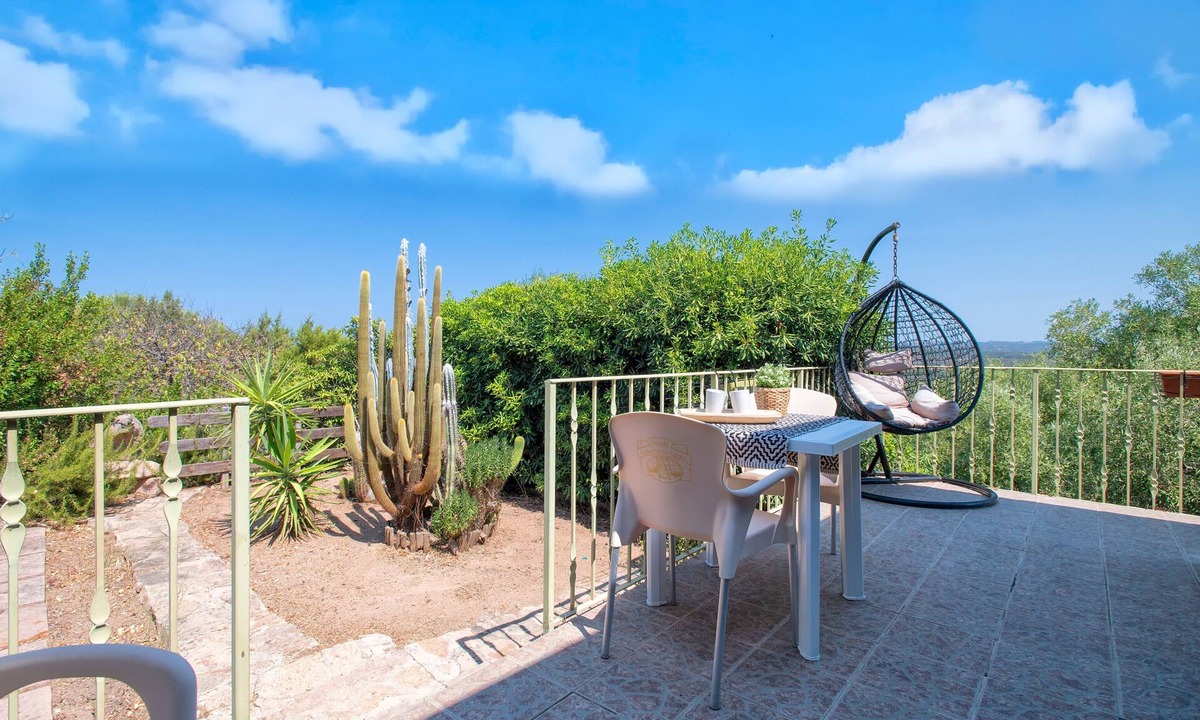 Paduledda House | Holiday Home "Breathtaking View in Isola Rossa" with Sea View, Private Terrace & AC