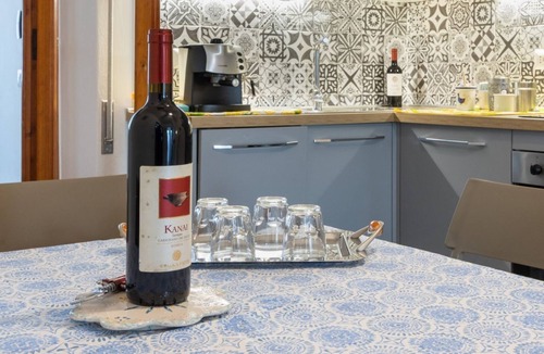 Sant'Antioco Apartment | A cozy and spacious 80 square meters apartment, perfect for four people, located on the first floor of a typical Sant'Antioco building (NO elevator).The property is located a short distance from the town center and offers quick access to the seafront. It