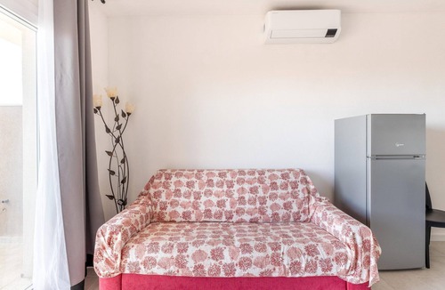 Castelsardo Apartment | Air-conditioned, in residence, with pool and patio