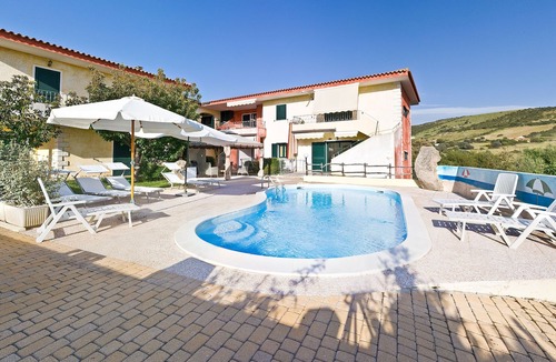 Trinita d'Agultu Apartment | Apartment in complex with swimming pool n. 3 P. earth