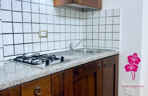 Teulada Apartment | Aparthotel & Rooms Residenza Locci Studio Apartment with Terrace in the greenery in the center of Teulada.