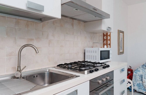 Murta Maria Apartment | Apartment 'Casa Vacanze Mirto' with Sea View, Shared Pool and Air Conditioning