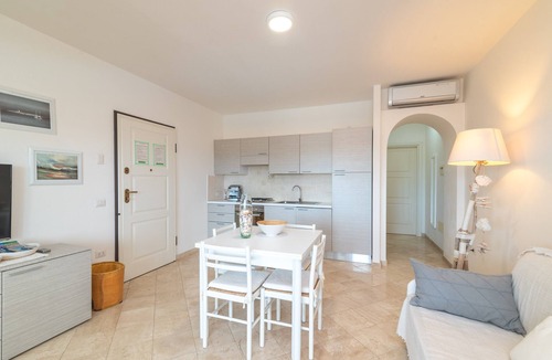 Porto Pozzo Apartment | Apartment 'Il Fiordo 17' with Sea View, Shared Pool and Air Conditioning
