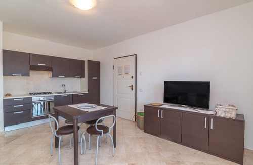 Porto Pozzo Apartment | Apartment 'Il Fiordo 16' with Sea View, Shared Pool and Air Conditioning