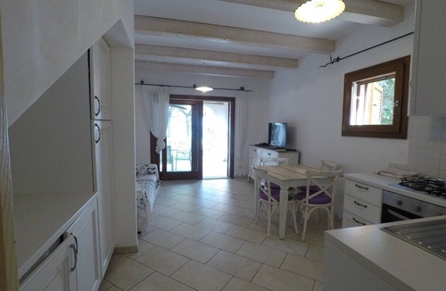 Cala Liberotto Apartment | Apartment 'La Corte Degli Ulivi A' with Sea View, Wi-Fi and Air Conditioning