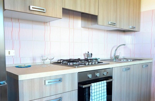 Budoni Apartment | Apartment 'Malamuri 1' with Shared Pool, Shared Garden and Wi-Fi