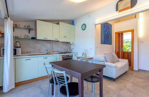 Lu Bagnu Apartment | Apartment 'Penthouse Villa Stefania' with Sea View, Wi-Fi and Air Conditioning