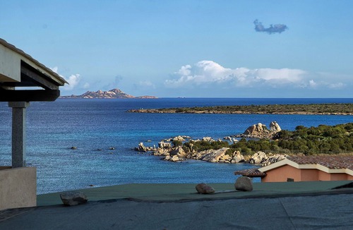 Golfo di Marinella Apartment | Beautiful apartment for 4 guests with A/C, pool, TV, patio and pets allowed