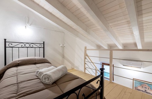 Pozzomaggiore Bed & Breakfast | Bed and Breakfast 'Camera Nuraghe Ruggiu' with Private Terrace, Wi-Fi and Air Conditioning