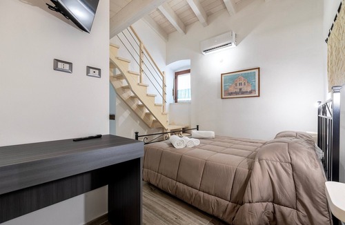 Pozzomaggiore Bed & Breakfast | Bed and Breakfast 'Camera Nuraghe Ruggiu' with Private Terrace, Wi-Fi and Air Conditioning