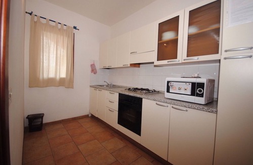 Monte Petrosu Apartment | COZY COTTAGE WITH GARDEN AND POOL 900 METERS FROM THE SEA