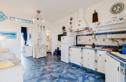 La Pelosa Apartment | Elegant and well furnished three-room apartment of about 49 square meters on the ground floor located a short distance from the sea.It consists of a living room with sofa and equipped kitchen, a bedroom with double bed, a bedroom with bunk beds and bathr