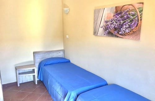 La Pelosa Bed & Breakfast | Functional 28 sq m room.Comprising a double bed, two single beds, and a private bathroom with shower, bidet, and hairdryer. The room also features an outdoor space with a sea view, a patio or terrace, and a table and chairs. Breakfast is included in the