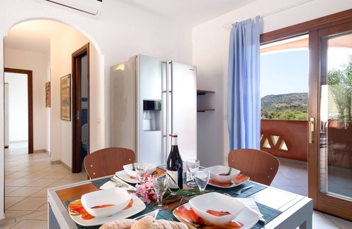Monte Petrosu Apartment | Granito's Apartment with Partial Sea View, Outdoor Space, and Air Conditioning
