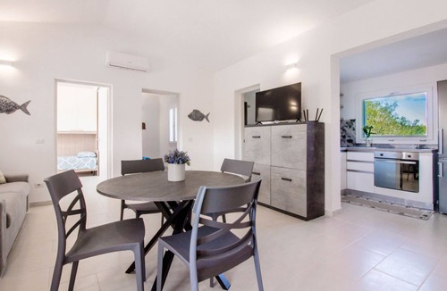 Porto Istana Apartment | GuestHost - Charming 60 sqm apartment located *1.2 km from Porto Istana Beach*. The accommodation is on the *first floor* (stairs required for access) and can accommodate up to *5 adults*.The property consists of *two bedrooms, a bathroom, a livin