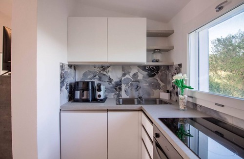 Porto Istana Apartment | GuestHost - Charming 60 sqm apartment located *1.2 km from Porto Istana Beach*. The accommodation is on the *first floor* (stairs required for access) and can accommodate up to *5 adults*.The property consists of *two bedrooms, a bathroom, a livin