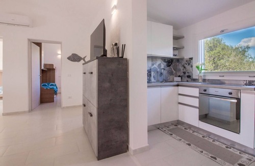 Porto Istana Apartment | GuestHost - Charming 60 sqm apartment located *1.2 km from Porto Istana Beach*. The accommodation is on the *first floor* (stairs required for access) and can accommodate up to *5 adults*.The property consists of *two bedrooms, a bathroom, a livin