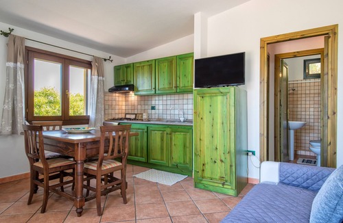 Paduledda House | Holiday Home "Breathtaking View in Isola Rossa" with Sea View, Private Terrace & AC