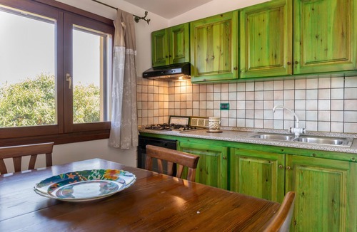 Paduledda House | Holiday Home "Breathtaking View in Isola Rossa" with Sea View, Private Terrace & AC