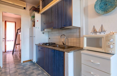 Stintino House | Holiday Home 'I Lentischi C13' with Sea View, Private Terrace and Air Conditioning