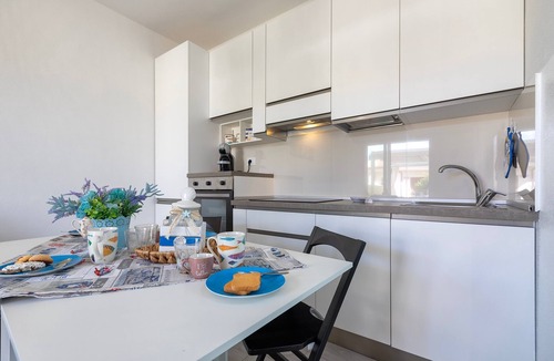 Lu Bagnu House | Holiday Home 'Marachele' with Shared Pool, Private Garden, and Air Conditioning
