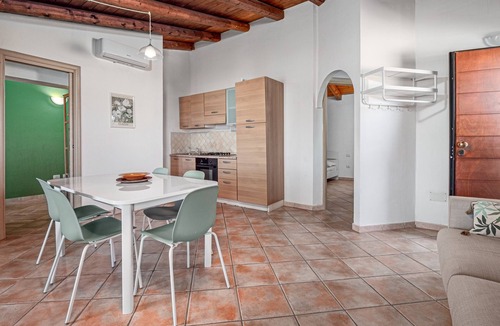 Baia Caddinas House | Holiday Home 'Orizzonti 33' with Sea View, Private Terrace and Air Conditioning