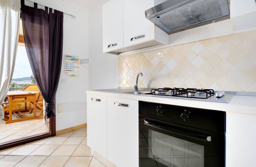 Baia Caddinas House | Holiday Home 'Residence Orizzonti App N 23' with Sea View, Private Terrace and Air Conditioning