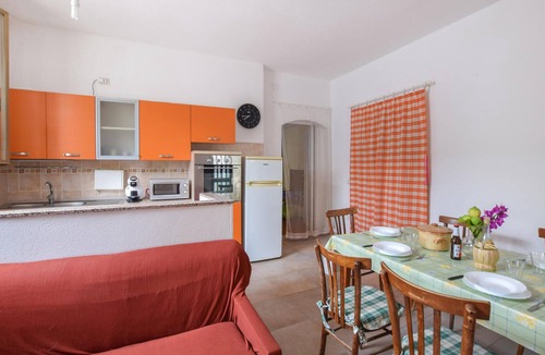 Cala Liberotto House | In the small seaside resort of Cala Liberotto, this practical vacation home welcomes you.
