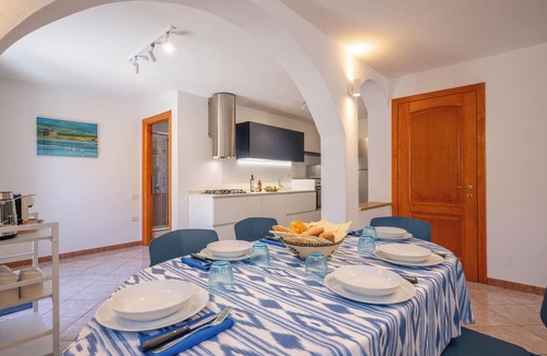 Capo Mannu House | Just 50 steps from the beach: Vacation Home for 9 Guests & BBQ
