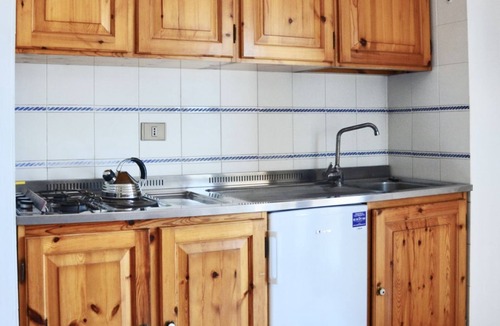 Lido Apartment | Le Residenze Buganvillea is situated on the north-west coast of Sardinia, about 1 km from the centre of Alghero, on the seafront in front of the town beach.Alghero, which can be reached in a few minutes by bicycle or by regular bus service, has a lively
