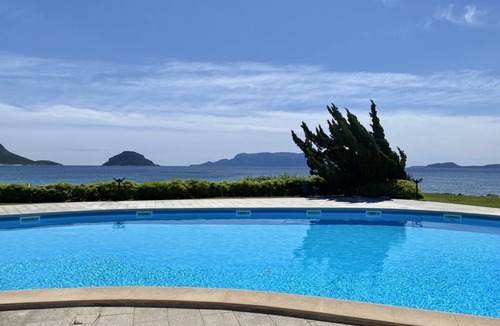 Baia Caddinas Apartment | Located in the side area of the residence, Elicriso is a one-bedroom apartment of approximately 55 sqm on the first floor, featuring a stunning sea view and a spacious panoramic terrace of 14 sqm. The terrace is furnished with a grani