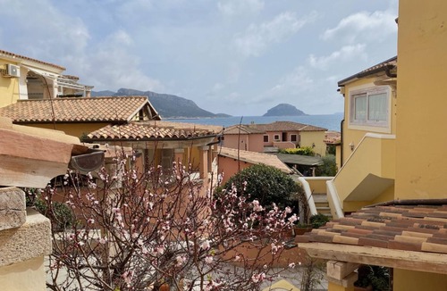 Baia Caddinas Apartment | Located in the side area of the residence, Elicriso is a one-bedroom apartment of approximately 55 sqm on the first floor, featuring a stunning sea view and a spacious panoramic terrace of 14 sqm. The terrace is furnished with a grani