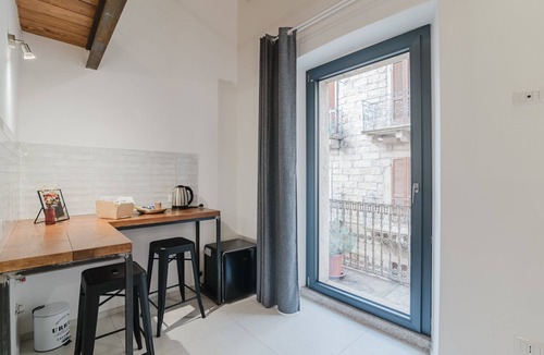 Calangianus Apartment | Quadruple Room with Balcony Overlooking the Main Street and Square, Air Conditioning