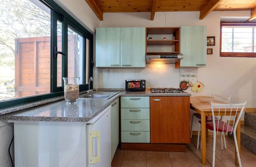 Paduledda Apartment | Studio Apartment with Sea View, Private Garden, and Air Conditioning