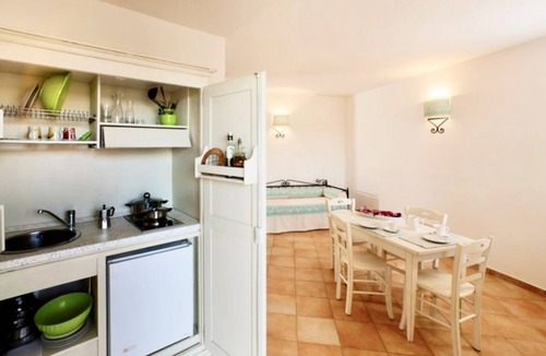 Aglientu House | Studio apartment for 3 people of 30 m2 furnished in Sardinian style.Located on the ground floor with veranda and small garden or first floor with balcony.Consisting of living room with kitchenette, 2 joinable single beds, single sofa bed, bathroom.Endowe