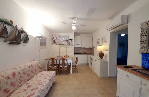 Golfo di Marinella Apartment | Three-room apartment of approximately 50 square meters, 300 meters from the sea and with older furnishings.It comprises a living room with a fully equipped kitchenette, a sofa bed, a double bedroom, a second bedroom with two single beds, and a bathroom w