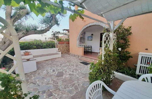 Golfo di Marinella Apartment | Three-room apartment of approximately 50 square meters, 300 meters from the sea and with older furnishings.It comprises a living room with a fully equipped kitchenette, a sofa bed, a double bedroom, a second bedroom with two single beds, and a bathroom w