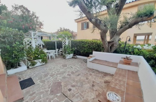 Golfo di Marinella Apartment | Three-room apartment of approximately 50 square meters, 300 meters from the sea and with older furnishings.It comprises a living room with a fully equipped kitchenette, a sofa bed, a double bedroom, a second bedroom with two single beds, and a bathroom w