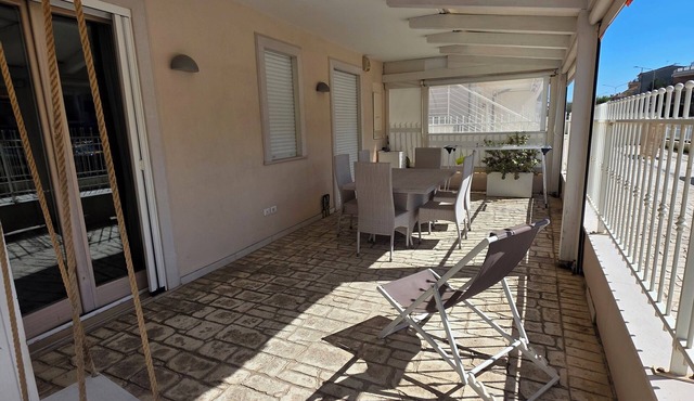 Elegantly renovated beachfront apartment with a courtyard and parking space
