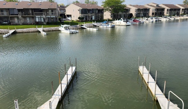 Gorgeous waterfront balcony view & boat dock on the shores of Lake Erie in Oak Harbor