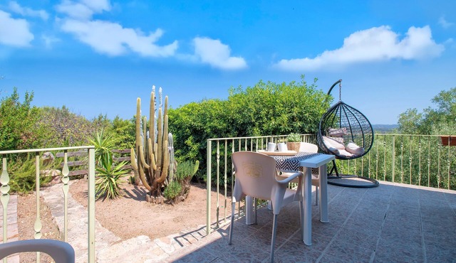 Holiday Home "Breathtaking View in Isola Rossa" with Sea View, Private Terrace & AC