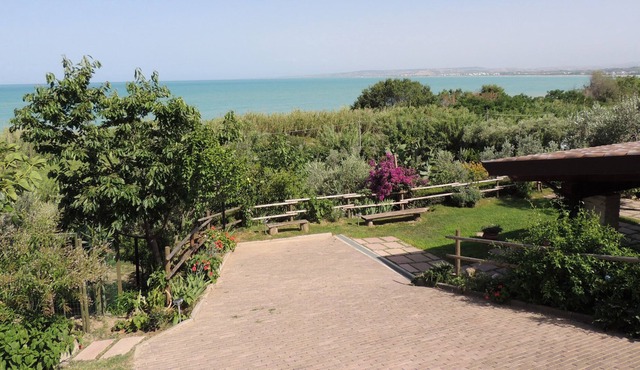 Private house with porch and garden, just steps from the beach