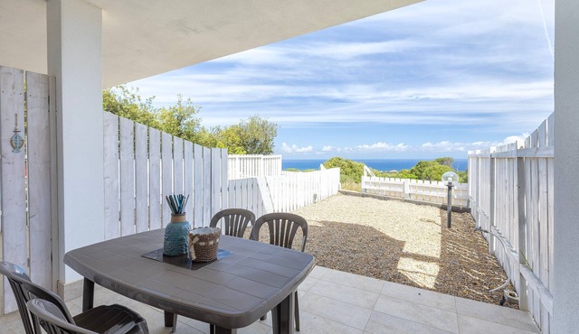 Sea View Isola Rossa Apartment with Sea View, Wi-Fi, and Air Conditioning