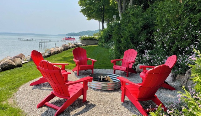 Stunning 150' ft footage on bay, 2 beachfront homes, 5 bedrooms & game room. in Suttons Bay