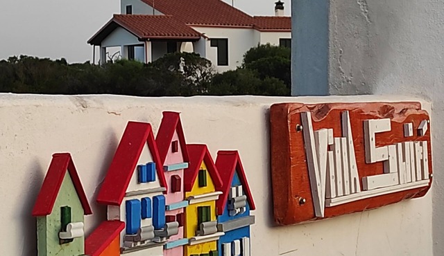 Villa with sea view, surrounded by greenery