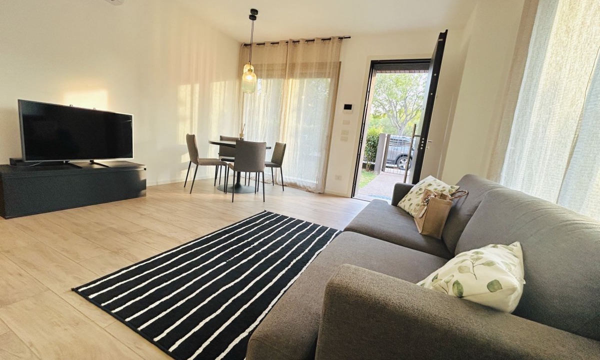 Alba Apartment | Elegant newly built apartment, located on the ground floor. Internally it consists of entrance on living room and kitchenette, double bedroom, twin bedroom, two bathrooms with shower. To complete the property large private garden and double outdoor parki