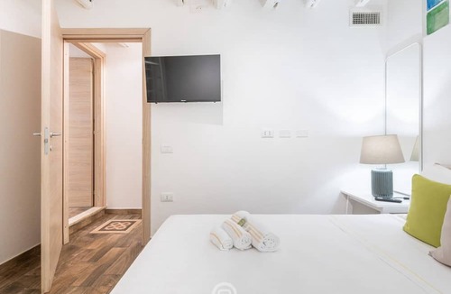 Cagliari Apartment | Cosmopolitan Retreat