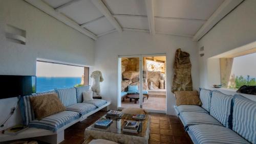 Designer villa among rocks, art and endless blue